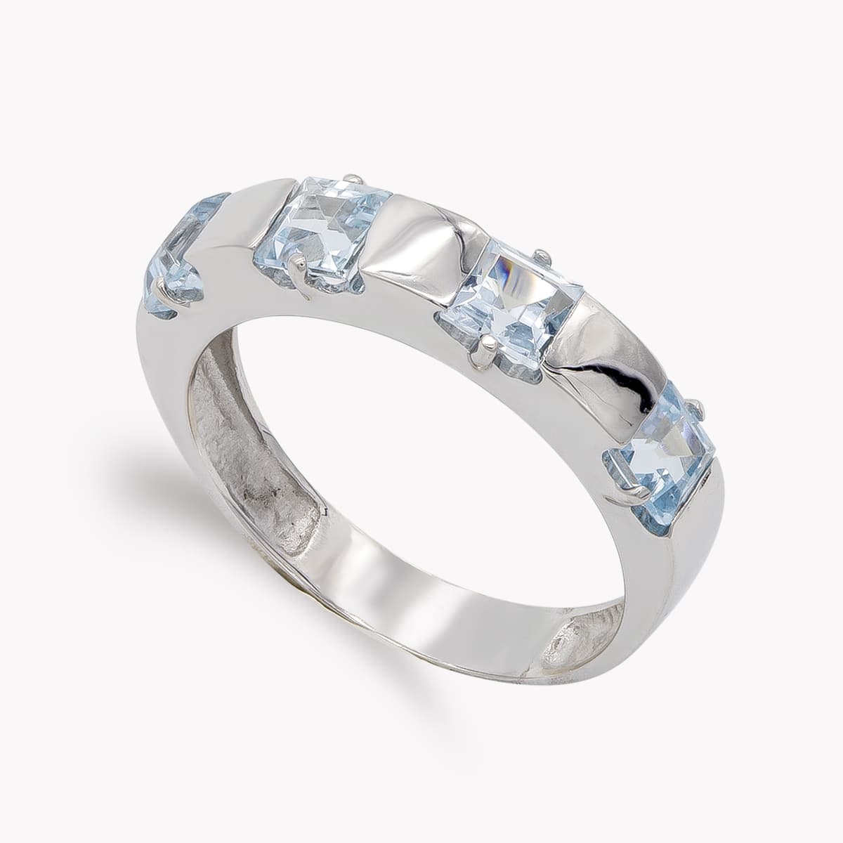 Sortija y Circonita Color Aguamarina. Ancho: 4 mm de oro blanco 18K