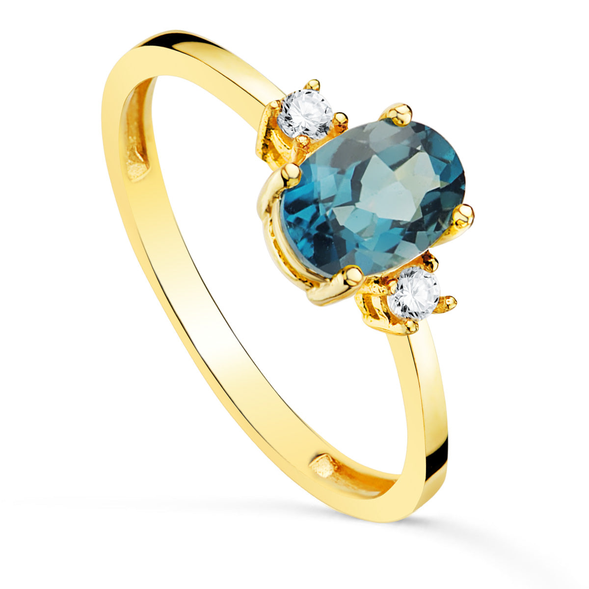 Sortija Piedra Azul Blue London 7 x 5 mm y Circonita Laterales de oro amarillo 18K
