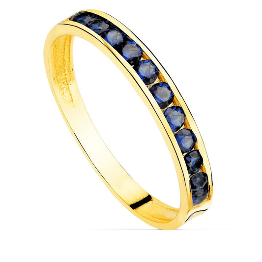 18K SORTIJA ORO AMARILLO CIRCONITA AZULES. ANCHO CUERPO 2.5 MM