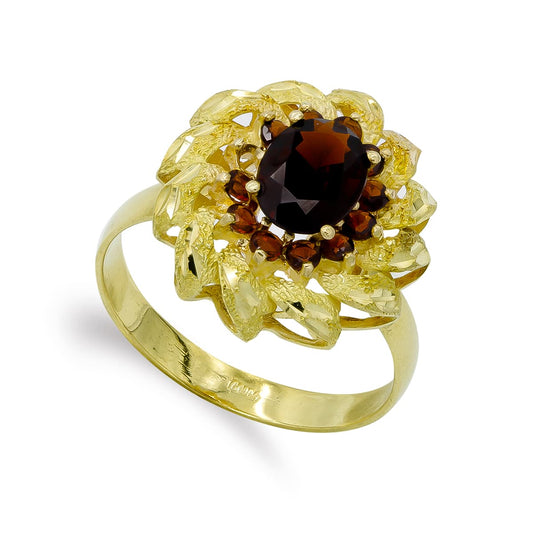 18K SORTIJA ORO AMARILLO Y GRANATE OVAL 8X6 MM CON CIRCONITA Y HOJAS. ANCHO: 17,5 MM