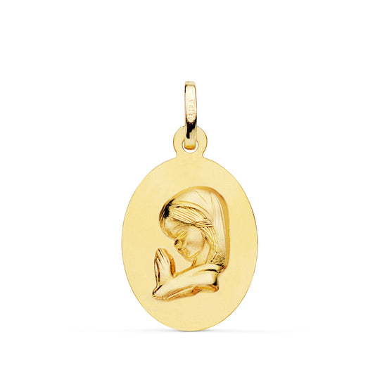 Medalla Virgen Niña Oval Lisa Matizada. Medida: 23 x 15 mm de oro amarillo 18K