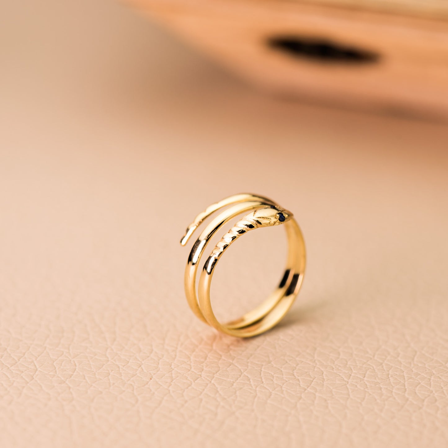 18K SORTIJA ORO AMARILLO SERPIENTE 2 VUELTAS CON OJOS AZULES