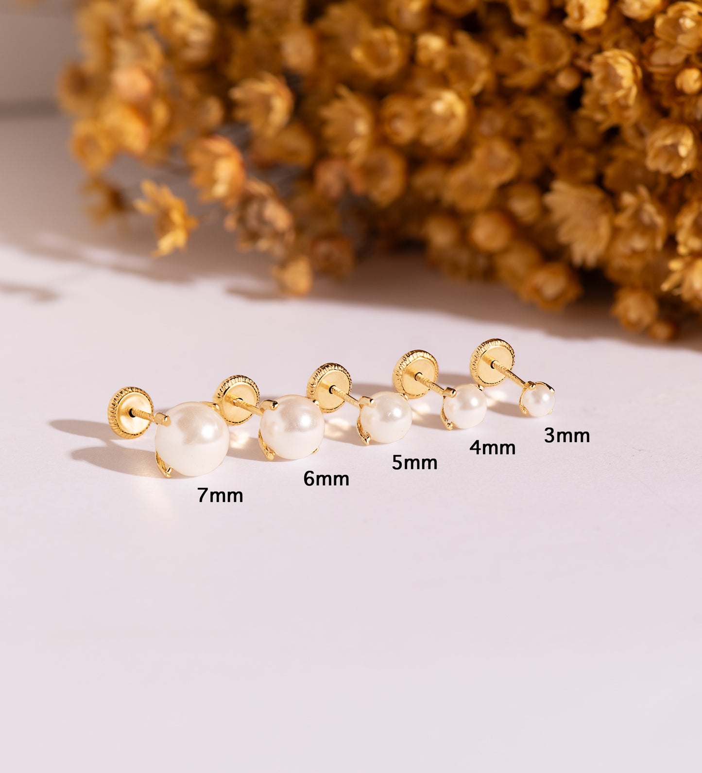 18K PENDIENTES ORO AMARILLO PERLA CON 4 GARRAS. MEDIDA: 7 MM. CIERRE TUERCA