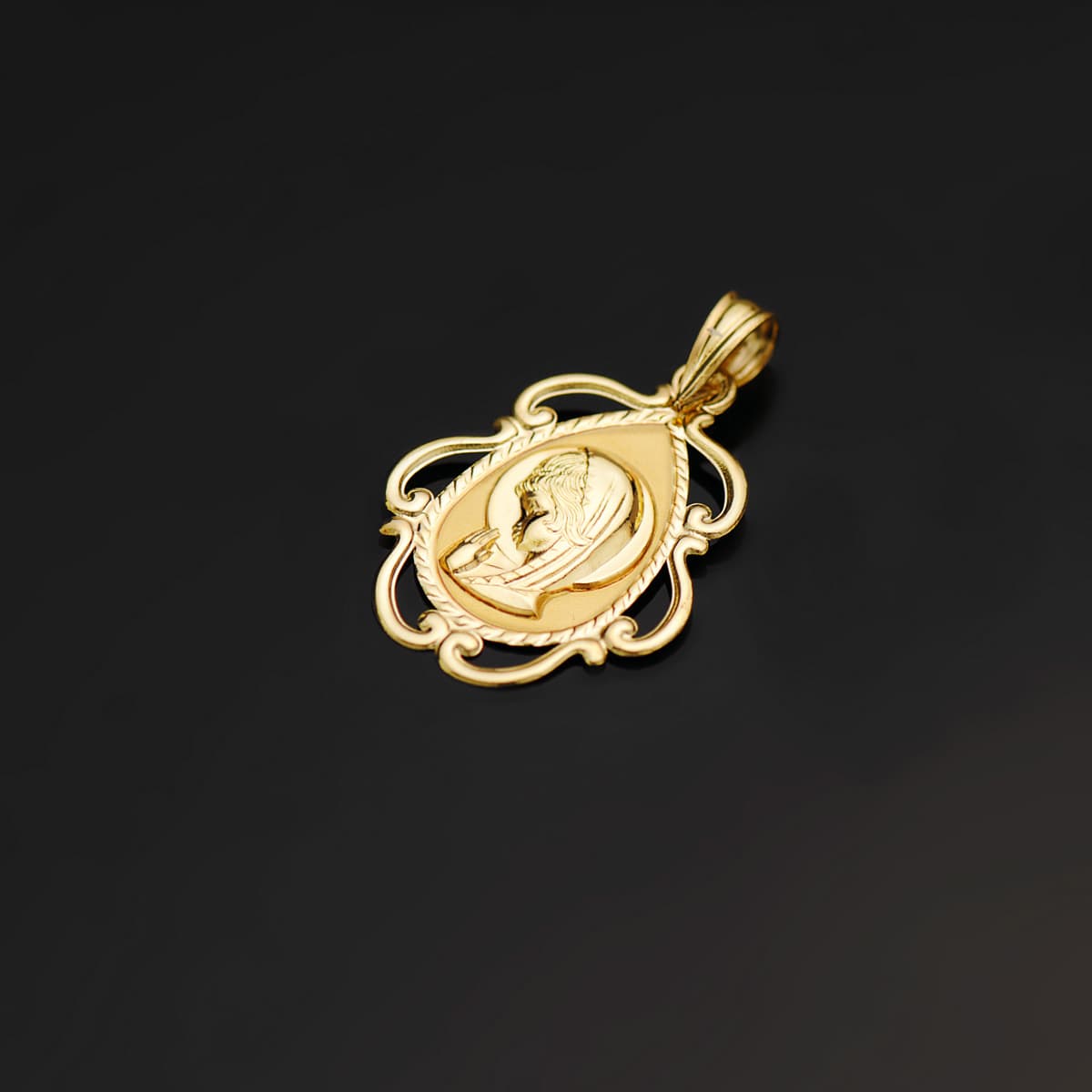 Medalla Virgen Niña Cerco Calado en Brillo . 22 x 16 mm de oro amarillo 18K